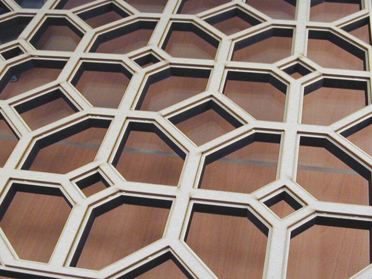 laser cut 1/8 inch and 1/2 inch thick MDF, glued together to feature profile