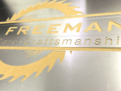 Laser cut custom logo stencil out of 1/16-inch-thick aluminum
