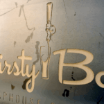 Laser cut Thirsty Bar logo out of steel laser cut custom logo on 1/8 inch thick steel