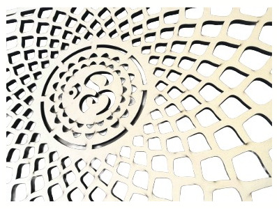 laser cut Om symbol out of 1/2-inch-thick maple plywood
