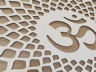 laser cut OM symbol out of 1/4 inch thick maple laser cut OM symbol out of 1/4 inch thick maple