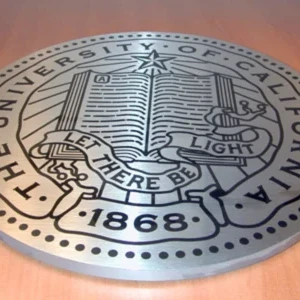 Laser etch UC Berkeley emblem on 3/4 inch thick brushed stainless steel disc Laser etch UC Berkeley emblem on 3/4 inch thick brushed stainless steel disc