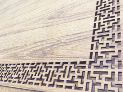 Laser cut design using reclaimed oak panel