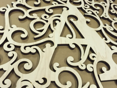 laser cut Apothic wine logo out of 3/4 inch thick maple plywood laser cut Apothic wine logo out of 3/4 inch thick maple plywood
