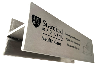 18-inch x 6-inch x 6-inch stainless steel beam section laser etching for a construction project completion ceremony
